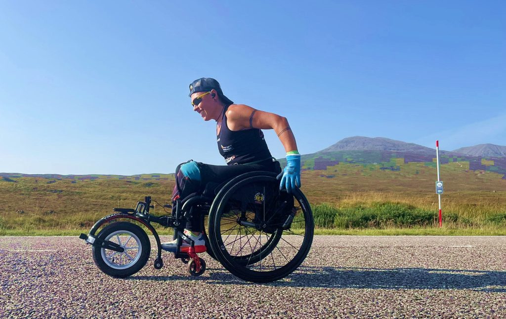 Amputee ex-NHS nurse Lexi Chambers sets a record as the first person to travel from John O'Groats to Land's End in a wheelchair, conquering 874 miles in 45 days.