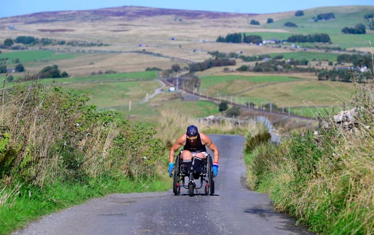 Amputee ex-NHS nurse Lexi Chambers sets a record as the first person to travel from John O'Groats to Land's End in a wheelchair, conquering 874 miles in 45 days.