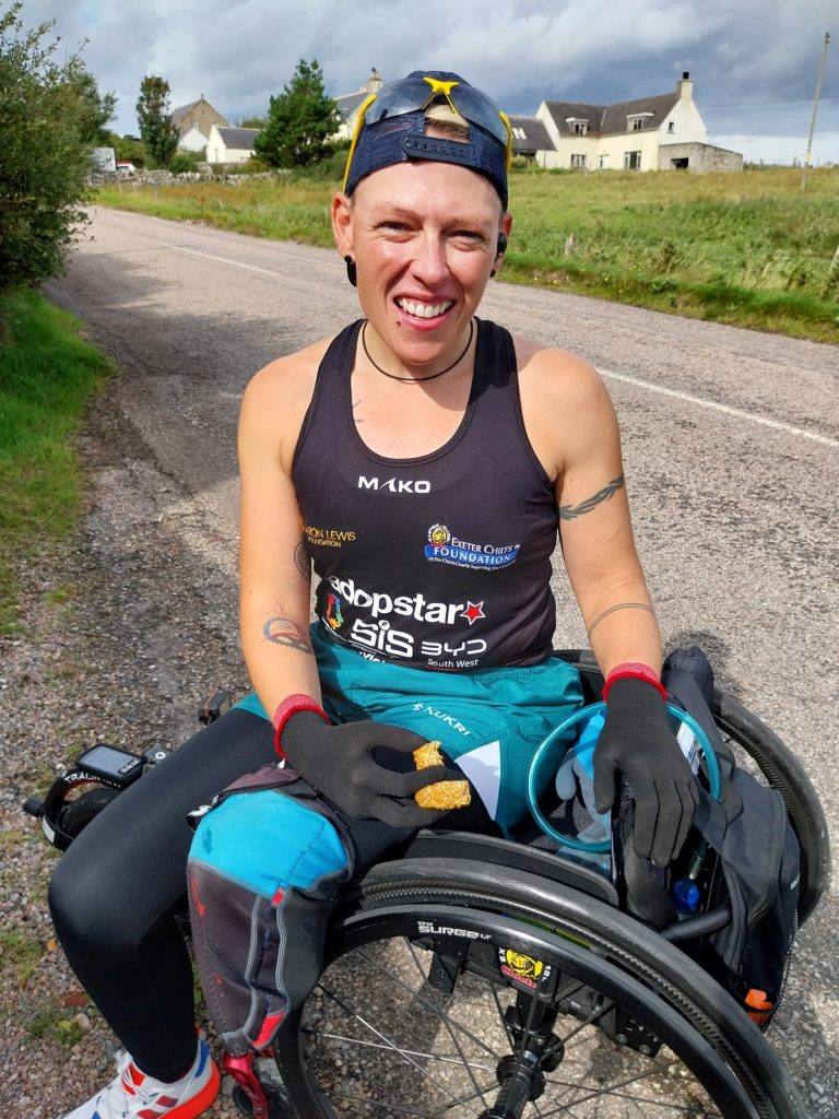 Amputee ex-NHS nurse Lexi Chambers sets a record as the first person to travel from John O'Groats to Land's End in a wheelchair, conquering 874 miles in 45 days.