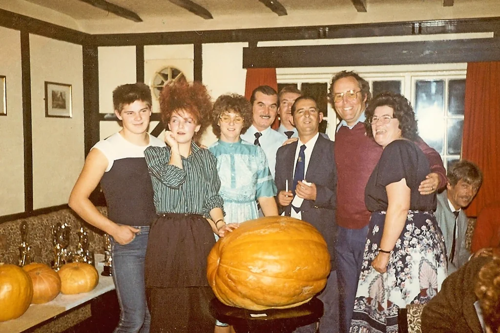 Kevin Fortey, Britain's giant veg king, breaks new records with a 21ft cucumber and 16-inch aubergine, adding to his impressive 11 world records in colossal fruit and veg growing.