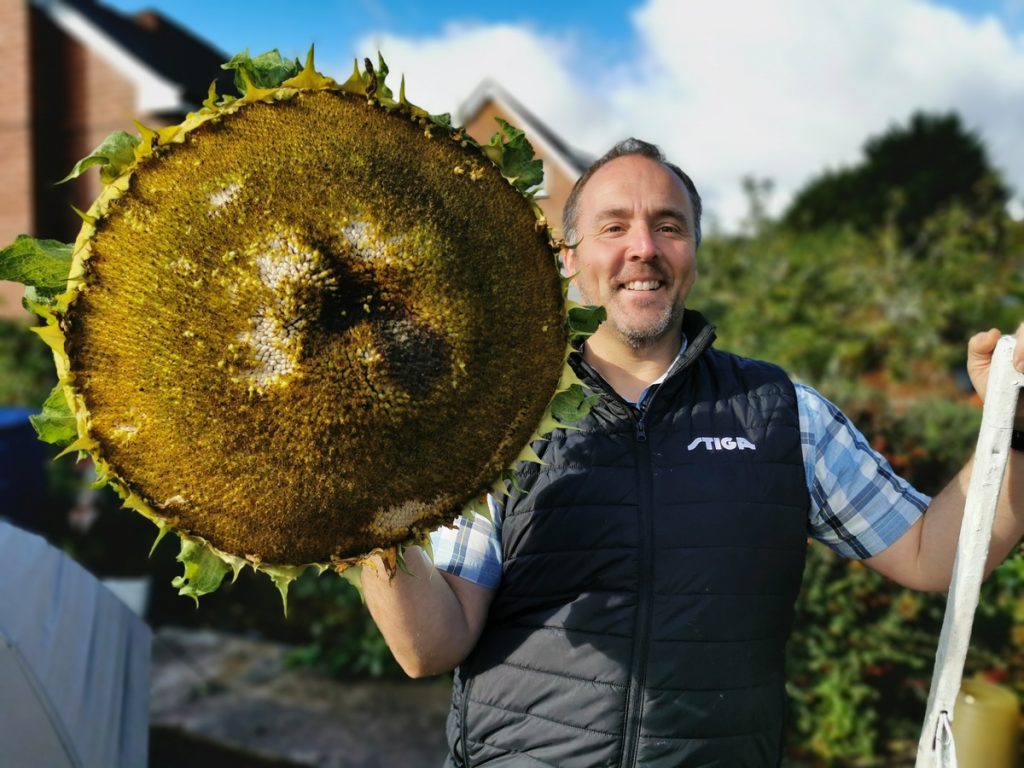 Kevin Fortey, Britain's giant veg king, breaks new records with a 21ft cucumber and 16-inch aubergine, adding to his impressive 11 world records in colossal fruit and veg growing.