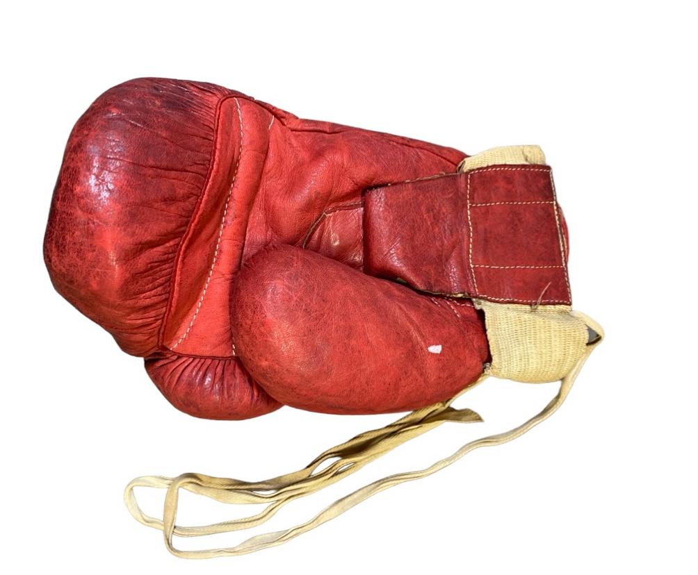 Muhammad Ali's iconic glove from his legendary 1963 fight against Henry Cooper is up for auction, expected to sell for £6 million. Discover the history behind this boxing relic!