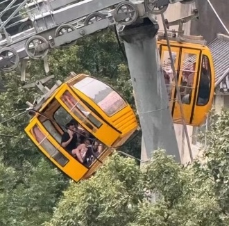 A tourist fell 30ft from a cable car in China after strong winds forced the doors open. Luckily, she survived with non-life-threatening injuries. Investigation ongoing.