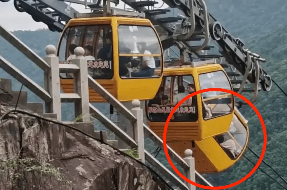 A tourist fell 30ft from a cable car in China after strong winds forced the doors open. Luckily, she survived with non-life-threatening injuries. Investigation ongoing.