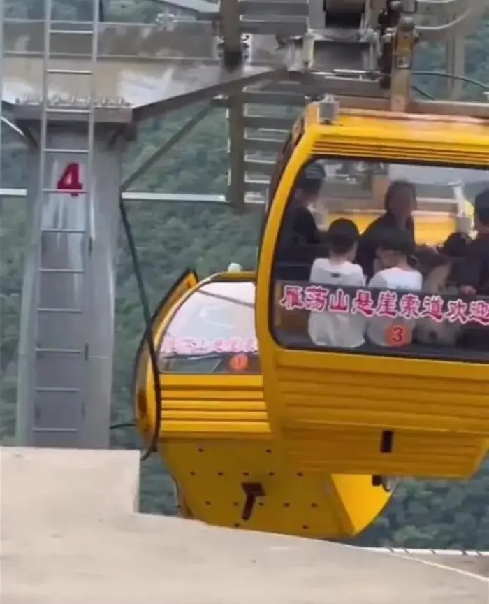 A tourist fell 30ft from a cable car in China after strong winds forced the doors open. Luckily, she survived with non-life-threatening injuries. Investigation ongoing.