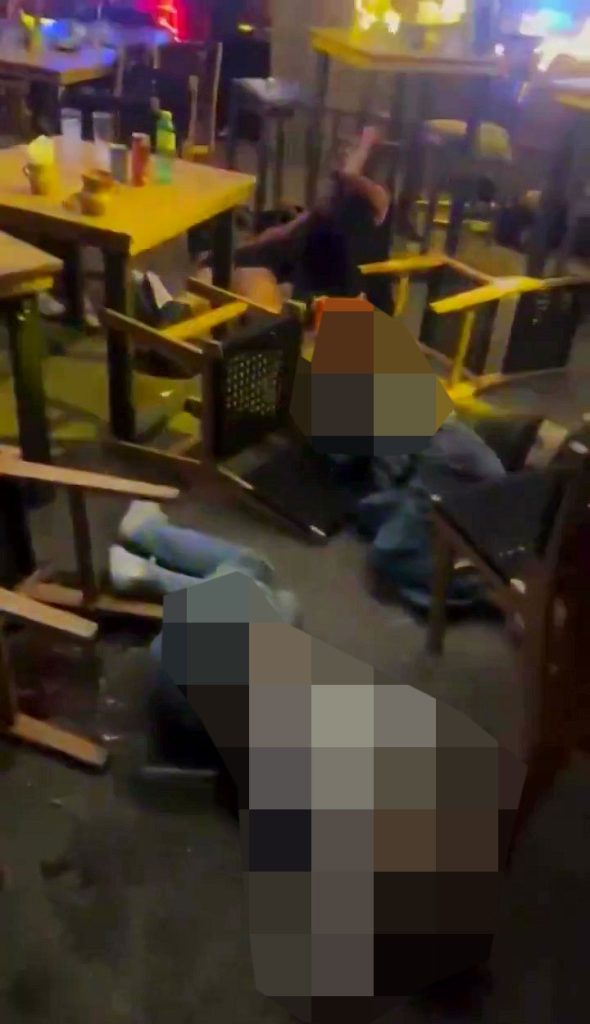 A cartel hitman known as "Skinny Guy" was the target of a brutal bar shooting in Mexico, leaving 10 dead. Shocking footage reveals the chaos amid a deadly cartel turf war.