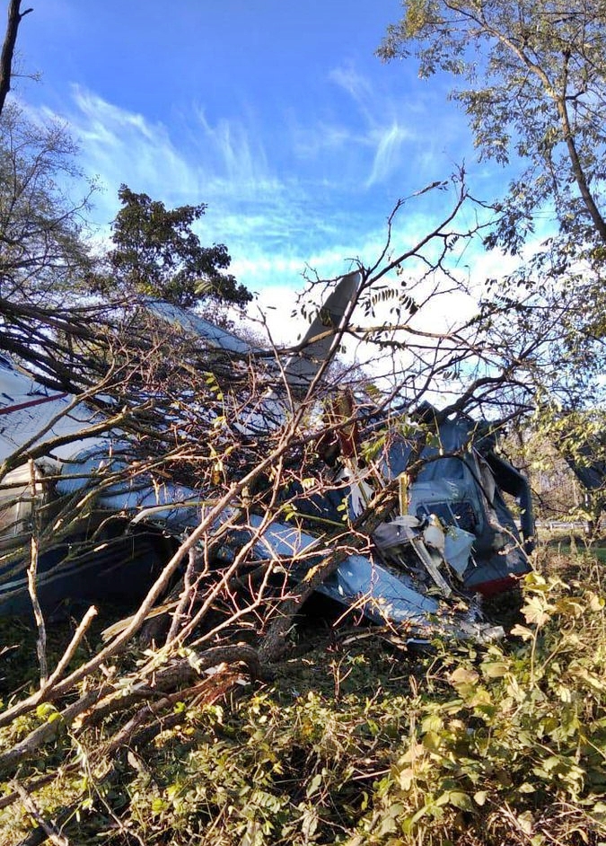 Russian plane with nine aboard crash-lands near busy motorway after engine failure; no fatalities reported. Antonov An-2TP narrowly avoids overpass, injuring four.