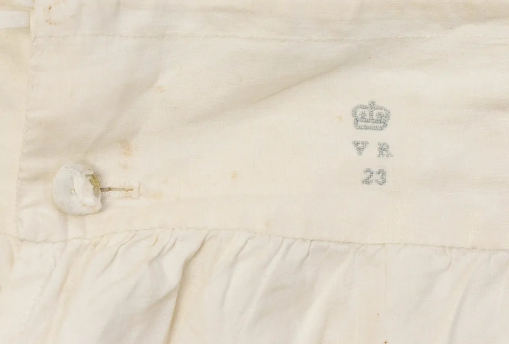 Queen Victoria’s vintage bloomers, chemise, and shoes, found in a Somerset wardrobe, head to auction with bids expected in the thousands. A rare royal memorabilia find!