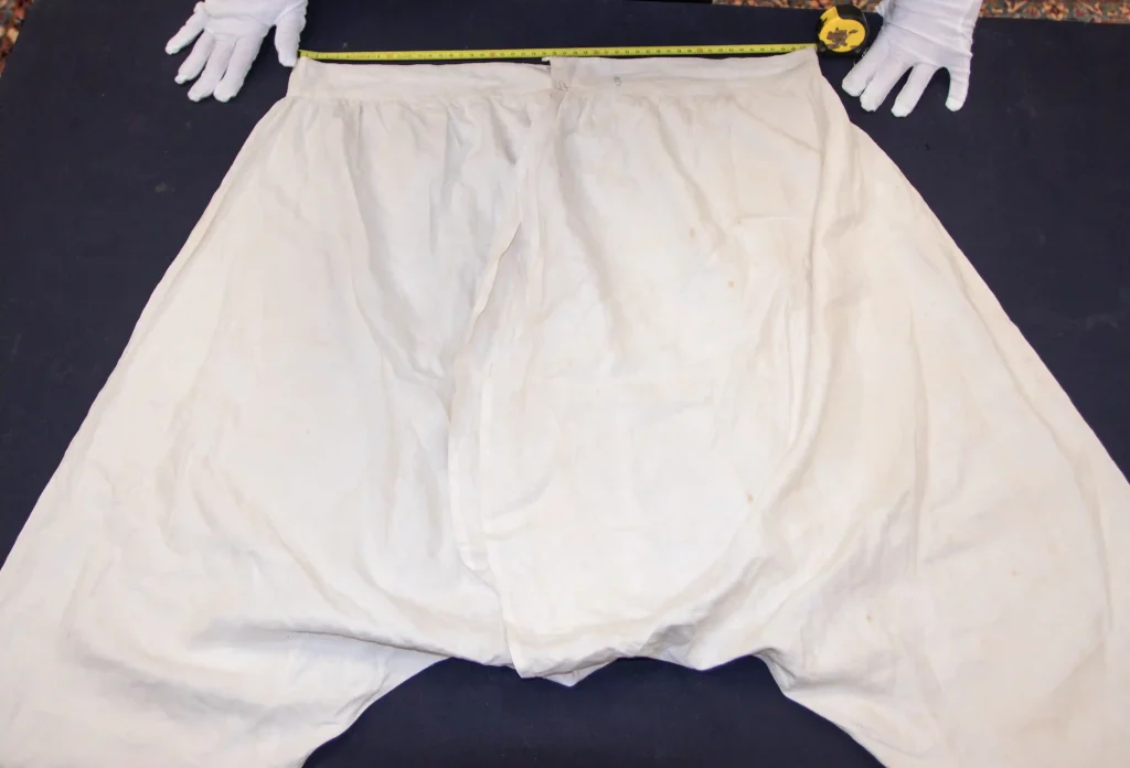 Queen Victoria’s vintage bloomers, chemise, and shoes, found in a Somerset wardrobe, head to auction with bids expected in the thousands. A rare royal memorabilia find!