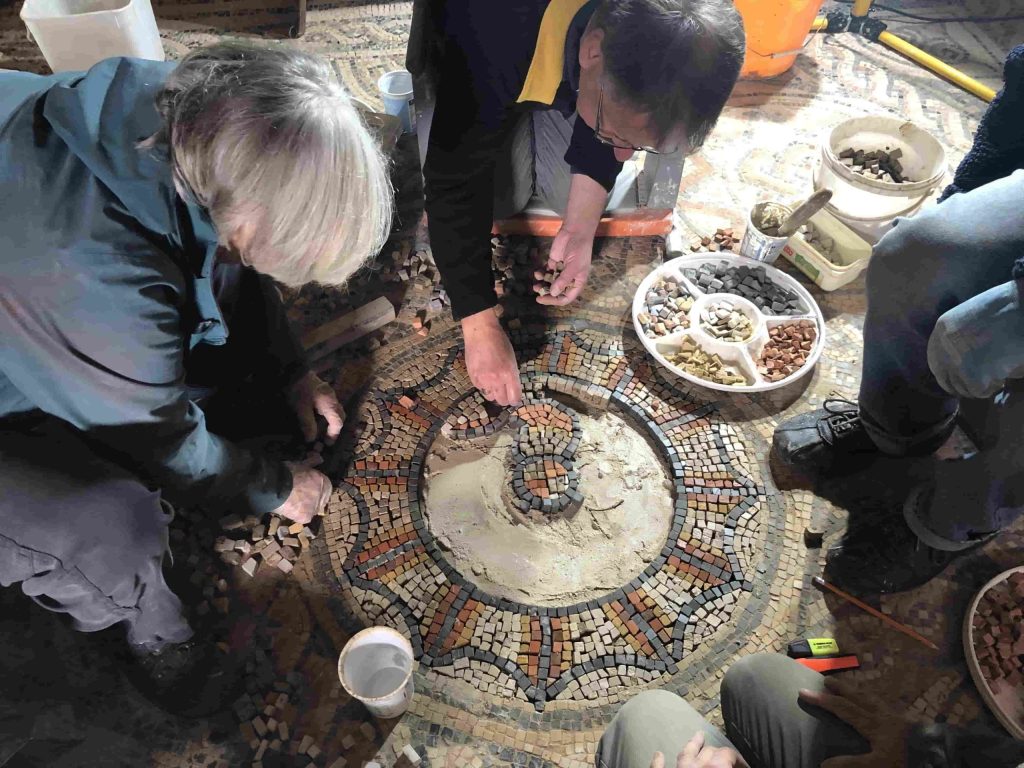 Discover how 140,000 hand-crafted stone cubes, authentic tools, and untrained volunteers brought a stunning Roman mosaic back to life in Somerset after five years of work!