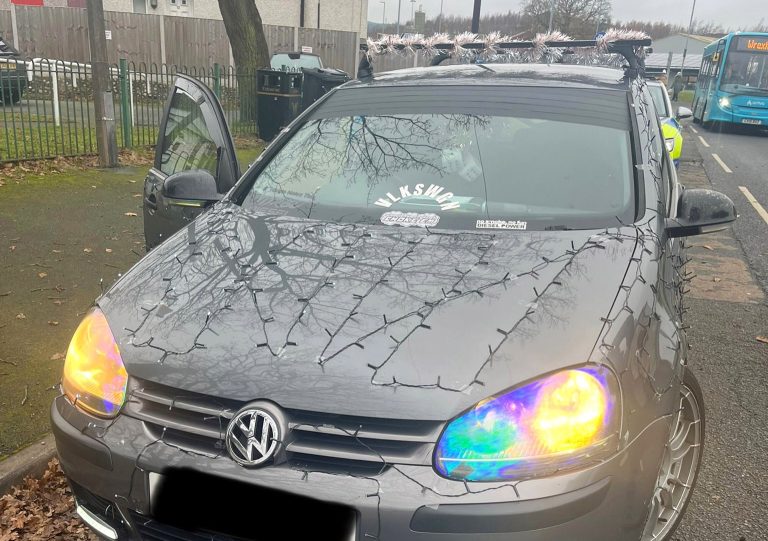 A driver’s festive Christmas lights on a car caused a stir in Wrexham as police pulled him over for safety concerns. See why his Sellotape décor didn’t make the cut!