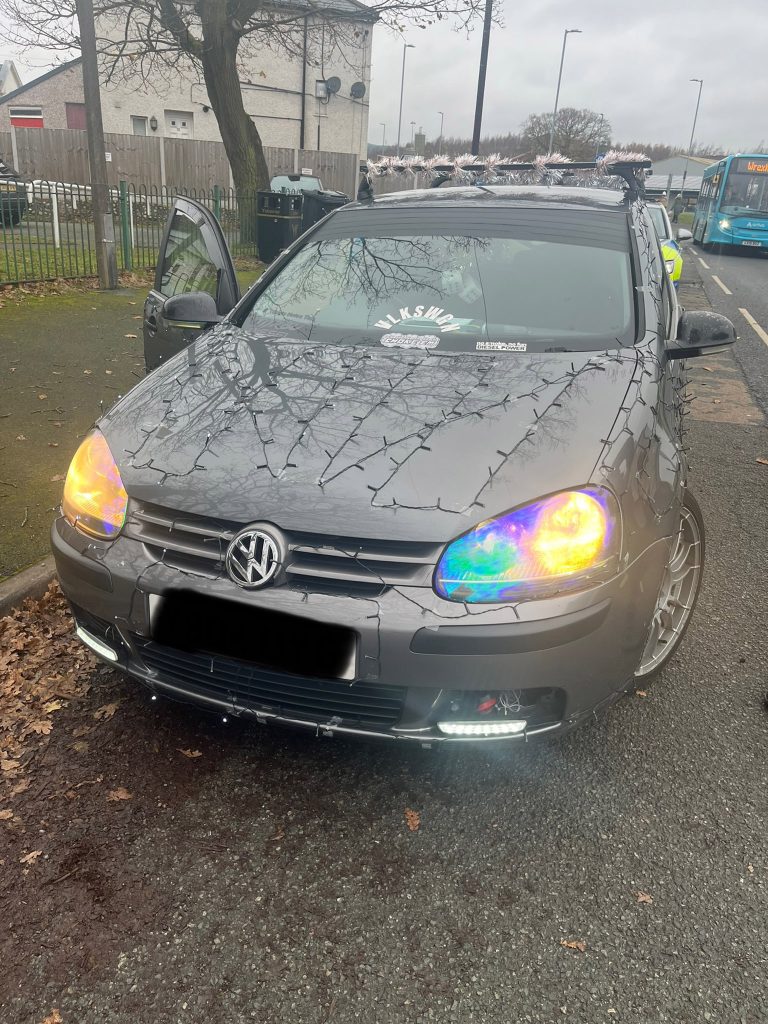 A driver’s festive Christmas lights on a car caused a stir in Wrexham as police pulled him over for safety concerns. See why his Sellotape décor didn’t make the cut!