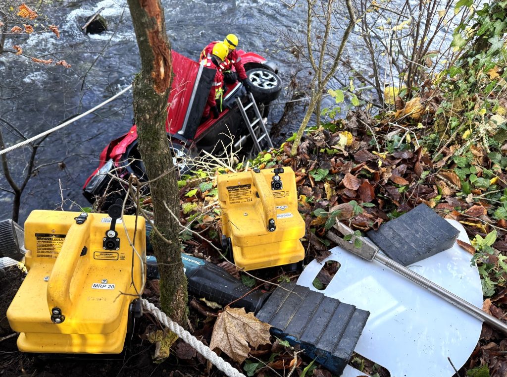 Heroic rescue as a passer-by saves a woman after her car plunges 14ft into a freezing Devon river. See how emergency crews braved challenges to bring her to safety!