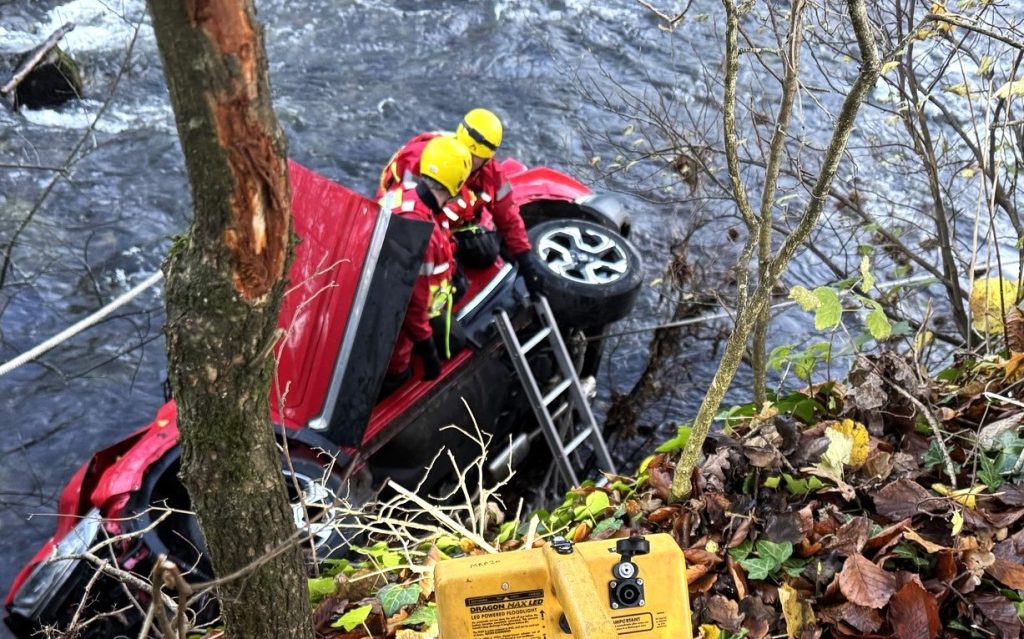 Heroic rescue as a passer-by saves a woman after her car plunges 14ft into a freezing Devon river. See how emergency crews braved challenges to bring her to safety!