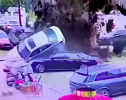 A boy's firecracker prank ignited methane gas in a sewer, causing a massive explosion that sent luxury cars flying in China. No injuries, but major damage!