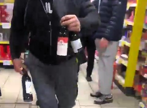 Brazen thief strolls out of Tesco in Hounslow with stolen wine as stunned shoppers watch. Caught on camera, the bold crime sparks outrage. Will justice be served?