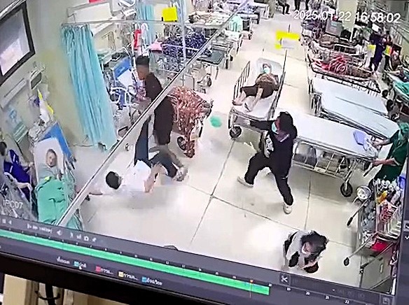 A tourist woke up confused in a Bangkok hospital and violently attacked doctors and nurses in a shocking outburst caught on CCTV. Police are still trying to identify him.