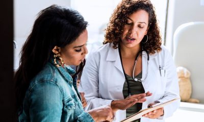 female talking to doctor clipboard 1200x628 facebook