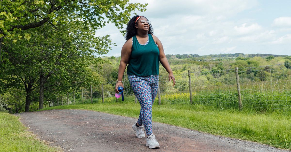 female walking outside 1200x628 facebook