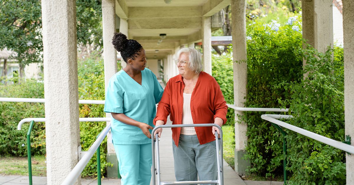 nurse elderly female walking 1200x628 facebook