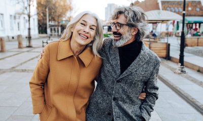 older couple walking outside smiles 1200x628 facebook