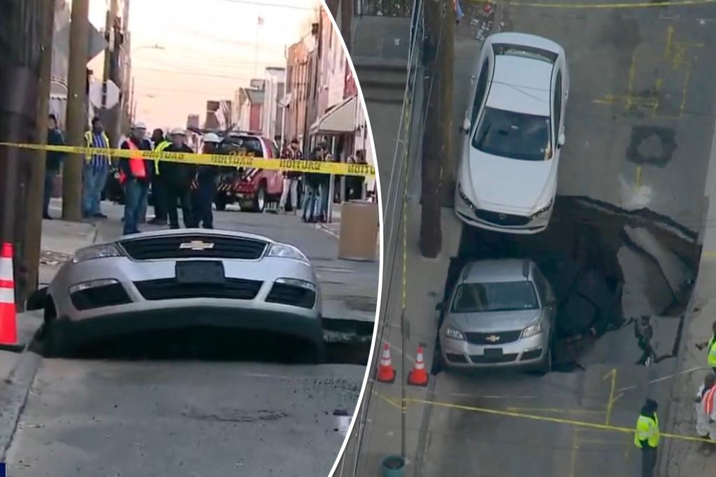 sinkhole swallows car philadelphia street 99252804