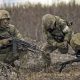 two russian soldiers preparing fire