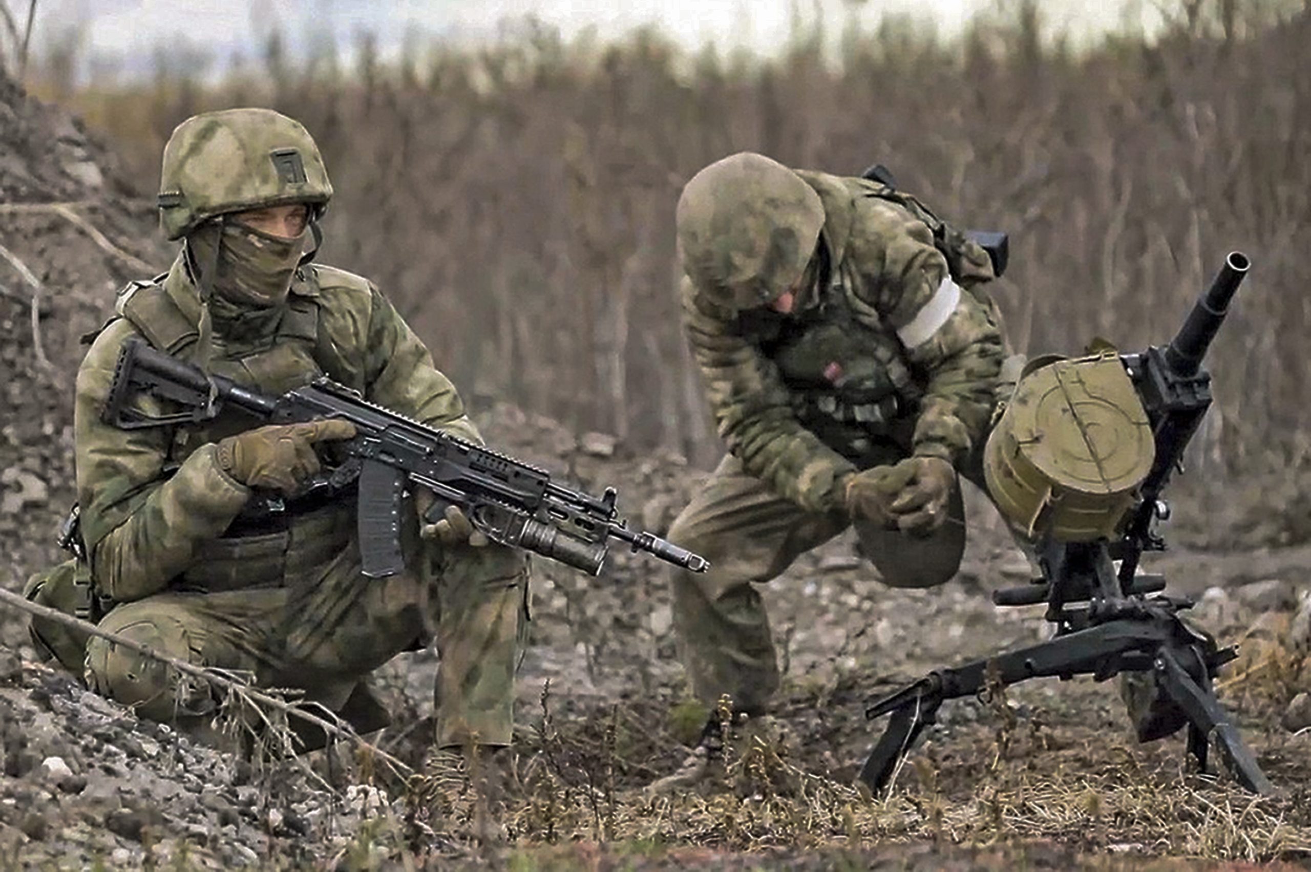 two russian soldiers preparing fire scaled