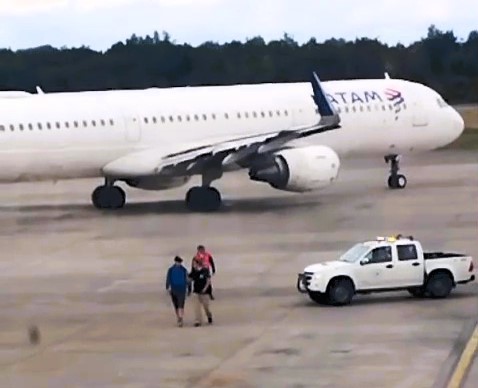 A man was arrested after bypassing security and running onto the runway to stop his missed flight from leaving, blocking the plane in a shocking airport breach.