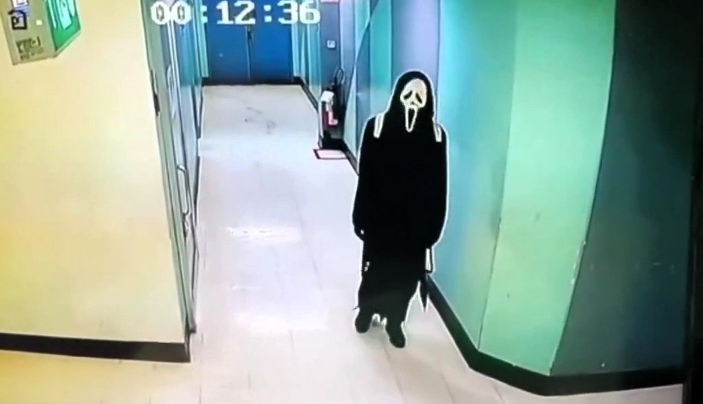 Masked in a *Scream*-style disguise, a man hid overnight in a Thai mall to rob a gold shop—only to get trapped and caught. Here's how his bizarre heist failed.