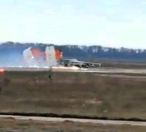 Russian Su-25 jet makes dramatic belly landing without landing gear near Ukraine border. Pilot praised for skill as viral video sparks debate and admiration.