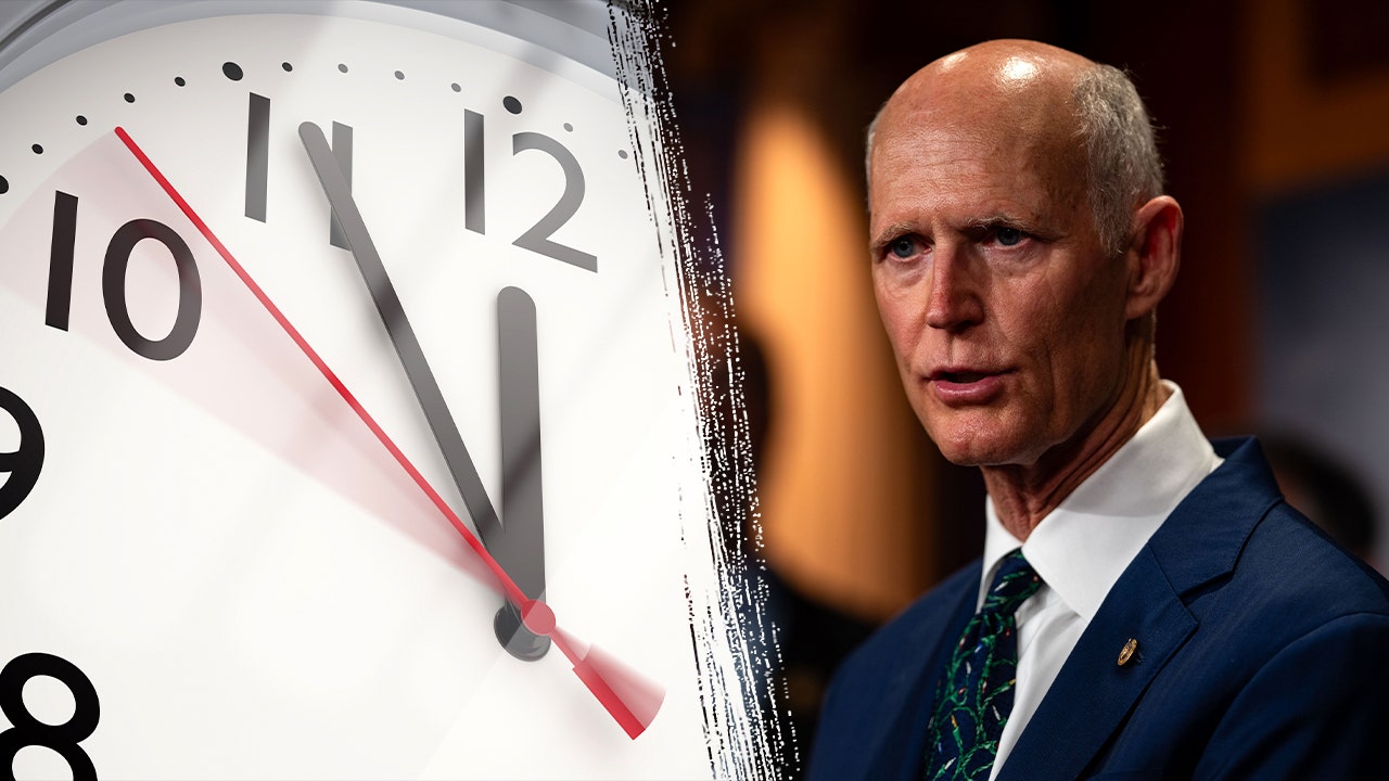 clock rick scott dst