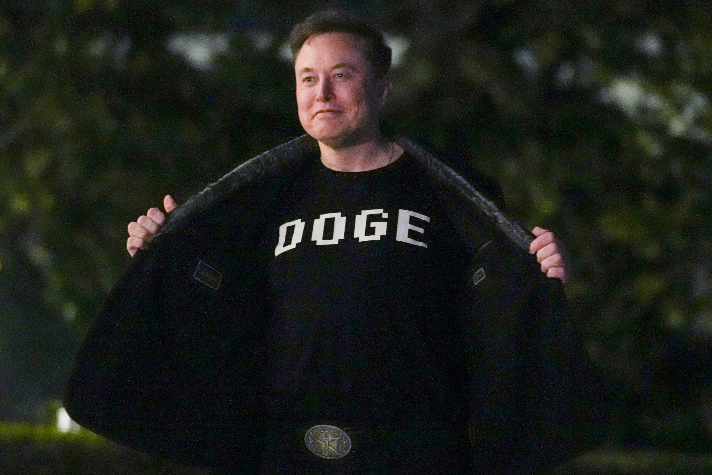 elon musk shows off shirt