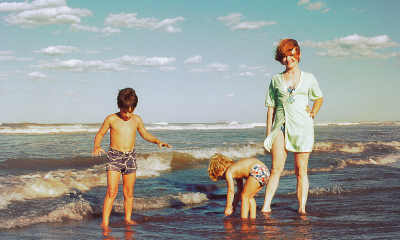 family enjoying beach trip out