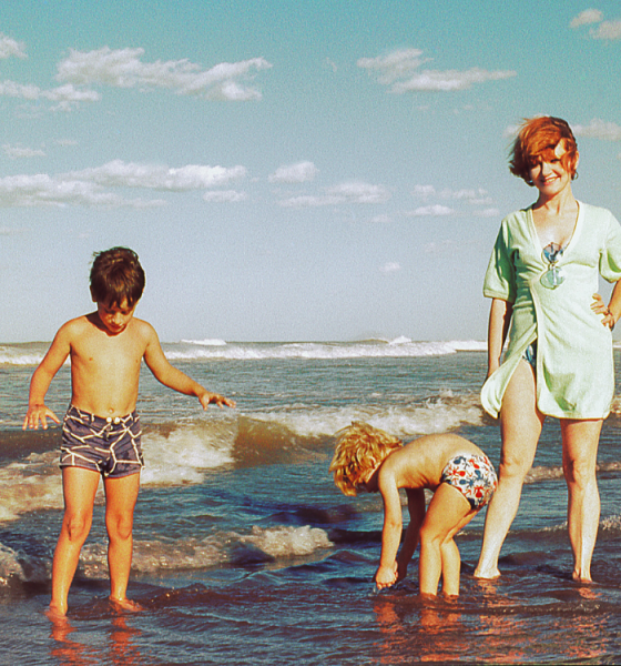 family enjoying beach trip out