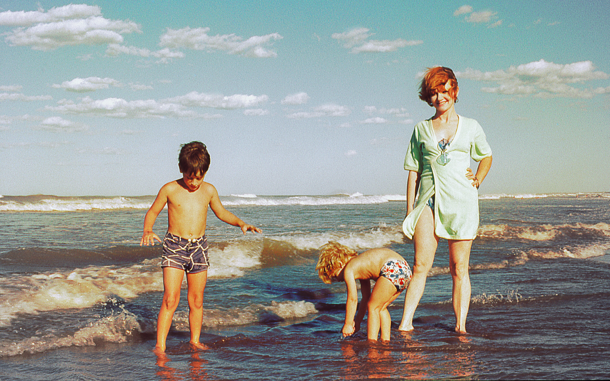 family enjoying beach trip out