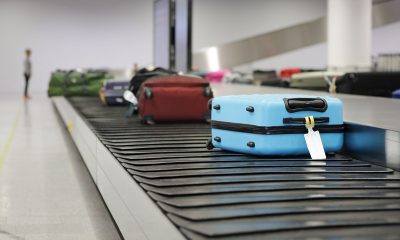 luggage on conveyor belt with tag