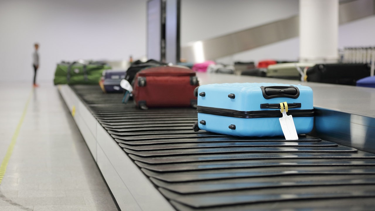 luggage on conveyor belt with tag