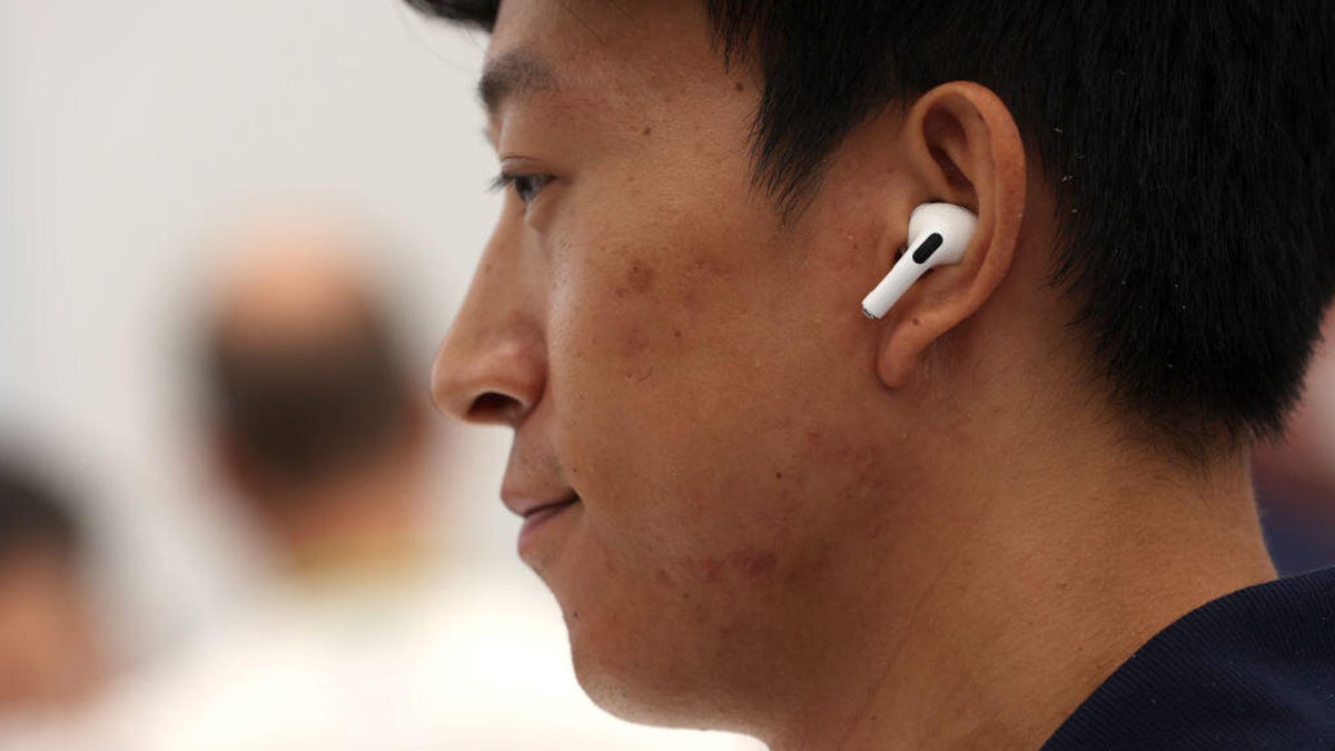 man wearing airpods gettyimages 1421695433