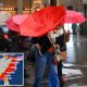 new yorkers walk heavy rain 100516599